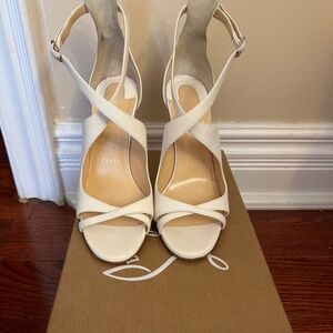 White Christian Louboutin heels